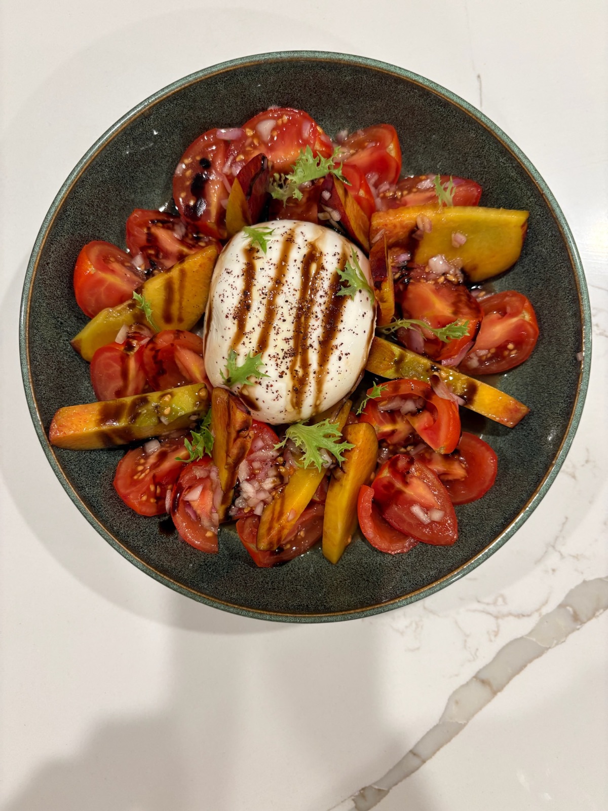 Burrata with heirloom tomatoes and stone fruit