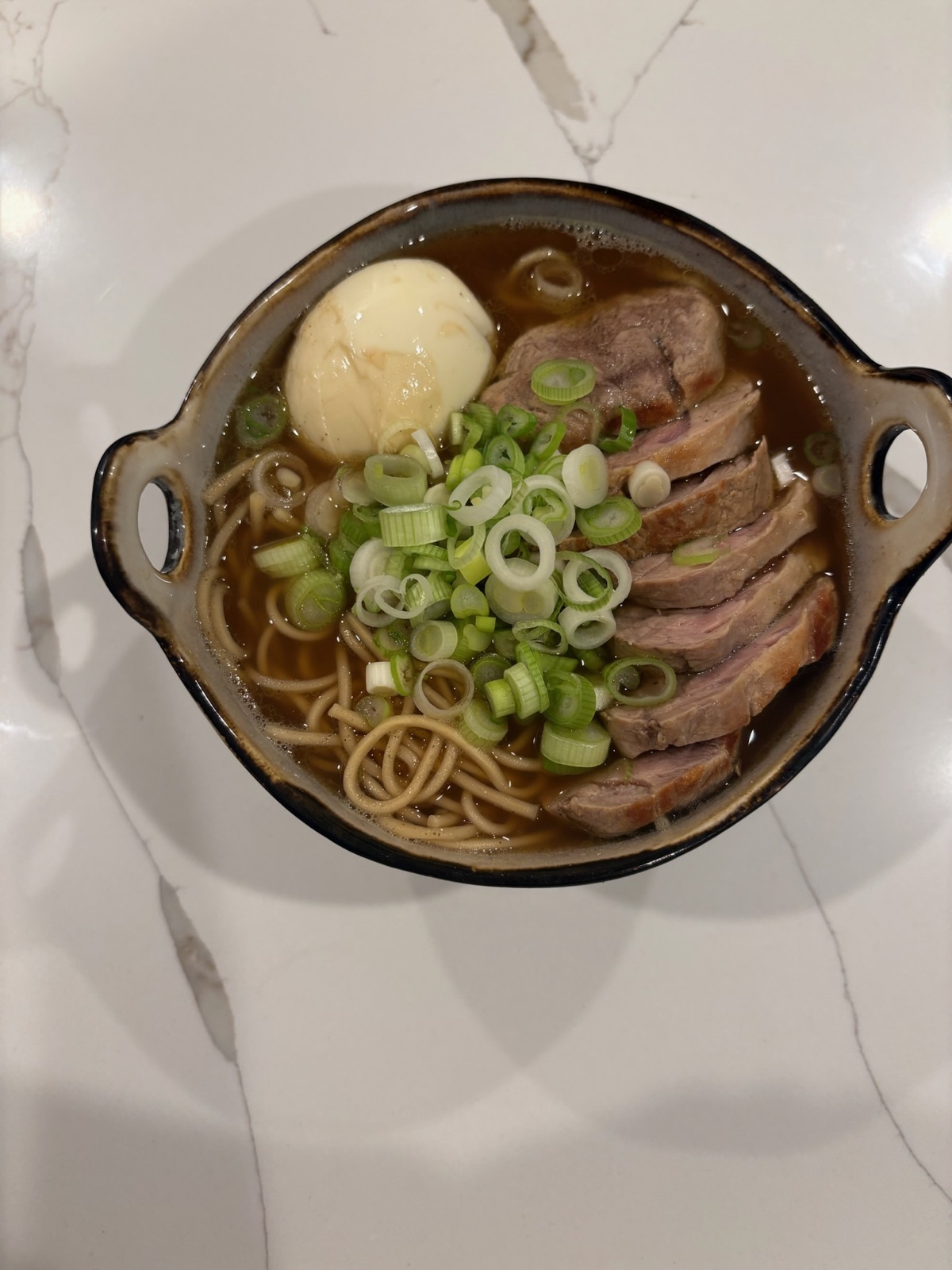 Duck and soba in broth with a jammy egg